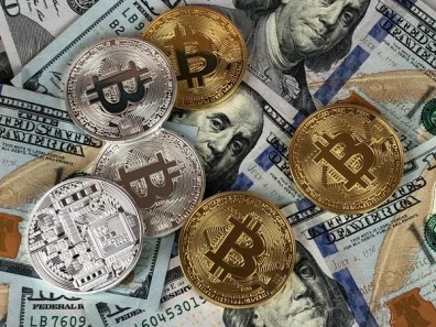 Colados em Wall Street, bitcoin e ethereum viram para alta